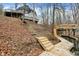 Exterior view of the home, stairs, and private boat dock on the water at 6655 Gopher Dr, Nineveh, IN 46164