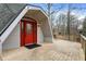 View of front entrance featuring a red door, wooden deck, and unique architectural details at 6655 Gopher Dr, Nineveh, IN 46164