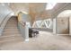 Spacious living room with dome ceiling, stairs, and large windows offering natural light at 6655 Gopher Dr, Nineveh, IN 46164
