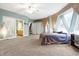 Main bedroom showcasing the unique architectural design, natural light, and access to an ensuite bathroom at 6655 Gopher Dr, Nineveh, IN 46164