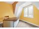 Bright office space with a large window, carpeted floor and unique architectural details, perfect for working from home at 6655 Gopher Dr, Nineveh, IN 46164
