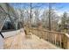 Wooden deck of a house showing the home's triangle window structure and view of the lake at 6655 Gopher Dr, Nineveh, IN 46164