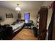 This bedroom features hardwood floors and a window at 721 Stover Ave, Indianapolis, IN 46227
