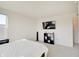 Bedroom with plush carpet and neutral decor with entertainment center at 7256 Firestone Rd, Whitestown, IN 46075
