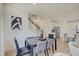Cozy dining room with stairs to the second floor and view to the kitchen at 7256 Firestone Rd, Whitestown, IN 46075