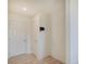 Clean hallway area with two doors and light wood flooring at 7256 Firestone Rd, Whitestown, IN 46075
