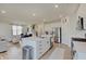 Bright kitchen features an island with seating, stainless steel appliances, and an open floor plan at 7256 Firestone Rd, Whitestown, IN 46075