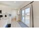 Bright kitchen with stainless steel appliances, island with breakfast bar, and sliding glass door to backyard at 7256 Firestone Rd, Whitestown, IN 46075