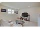 Cozy living room features neutral walls, carpet, contemporary furnishings, and memorabilia at 7256 Firestone Rd, Whitestown, IN 46075