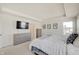 Bright main bedroom with a large bed, neutral furniture, and natural light from windows at 7256 Firestone Rd, Whitestown, IN 46075