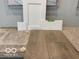 Selection of interior materials including flooring samples, countertop sample, and white cabinetry at 7310 Raybourn Ct, Indianapolis, IN 46259