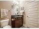 Cozy bathroom with a dark wood vanity, granite countertops, and neutral wall color, providing a serene ambiance at 802 N Meridian St # 103, Indianapolis, IN 46204