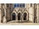 Detailed stone entrance of a historic building, showcasing arched doorways and classic architecture at 802 N Meridian St # 103, Indianapolis, IN 46204