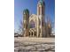 Elegant stone church featuring two ornate towers and intricate window designs on a clear day at 802 N Meridian St # 103, Indianapolis, IN 46204