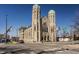 Stunning stone church with unique architecture and two prominent towers against a clear blue sky at 802 N Meridian St # 103, Indianapolis, IN 46204