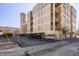 Apartment building showcasing balconies and a parking area in front at 802 N Meridian St # 103, Indianapolis, IN 46204