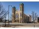 Beautiful stone church with grand windows and two tall towers in a historic architectural style at 802 N Meridian St # 103, Indianapolis, IN 46204