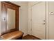 Charming entry featuring a wooden hall tree with a mirror and a comfortable bench at 802 N Meridian St # 103, Indianapolis, IN 46204