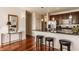 Well-appointed kitchen with granite countertops, stainless steel appliances, and breakfast bar seating at 802 N Meridian St # 103, Indianapolis, IN 46204