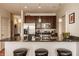 Modern kitchen with granite countertops, stainless steel appliances, and dark wood cabinetry at 802 N Meridian St # 103, Indianapolis, IN 46204