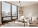 Bright living room with large windows offering city views, comfortable seating, and stylish decor at 802 N Meridian St # 103, Indianapolis, IN 46204