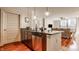 Open living space combining kitchen and living room, featuring modern amenities and city views at 802 N Meridian St # 103, Indianapolis, IN 46204