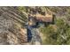 Aerial view of a single-Gathering home with a well-maintained yard, mature trees, and a spacious driveway at 8172 S Shoreview Dr, Trafalgar, IN 46181