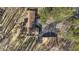 Aerial view of a single-Gathering home with a well-maintained yard, mature trees, and a spacious driveway at 8172 S Shoreview Dr, Trafalgar, IN 46181