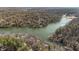 Breathtaking aerial view of lakefront property with private docks surrounded by lush forest at 8172 S Shoreview Dr, Trafalgar, IN 46181