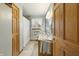 Bright bathroom featuring natural wood accents, a marble vanity, and a shower with a decorative curtain at 8172 S Shoreview Dr, Trafalgar, IN 46181