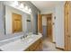 Well-lit bathroom showcasing a marble vanity, a large mirror, and modern fixtures at 8172 S Shoreview Dr, Trafalgar, IN 46181