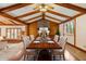 Bright dining room features vaulted ceilings, wood beams, and seating for six at 8172 S Shoreview Dr, Trafalgar, IN 46181
