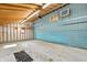 Unfinished garage featuring exposed rafters and blue block walls at 8172 S Shoreview Dr, Trafalgar, IN 46181