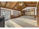 Bright living room with vaulted wood ceiling, fireplace, and large windows offering scenic views at 8172 S Shoreview Dr, Trafalgar, IN 46181