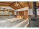 Open living room features vaulted wood ceiling, fireplace, and convenient access to other rooms at 8172 S Shoreview Dr, Trafalgar, IN 46181