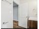 Clean bathroom featuring a single sink and access into another room at 929 N Beville Ave, Indianapolis, IN 46201