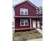 Stylish two-story house with a maroon exterior, covered porch, and contemporary design at 929 N Beville Ave, Indianapolis, IN 46201