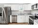 Stylish kitchen featuring stainless steel appliances, white cabinets, and sleek countertops at 929 N Beville Ave, Indianapolis, IN 46201