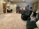 Spacious basement featuring cozy seating, a dining table, and a shelving unit, creating a versatile living space at 1002 Plummer Rd, Martinsville, IN 46151
