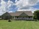 Charming single-story home featuring a welcoming front porch, well-maintained lawn, and tasteful landscaping at 1002 Plummer Rd, Martinsville, IN 46151