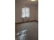 Clean bedroom featuring carpet floors and a bright window, providing a serene and comfortable space at 1035 Ina Cir, Franklin, IN 46131