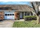 Charming single-story home with a brick facade, attached garage, and well-maintained landscaping at 1035 Ina Cir, Franklin, IN 46131