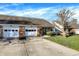 The property has a brick facade, well-manicured lawn, and an inviting walkway leading to the entrance at 1035 Ina Cir, Franklin, IN 46131