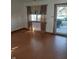 Bright living room featuring hardwood floors and natural light from a window with elegant drapes at 1035 Ina Cir, Franklin, IN 46131