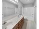 Bright bathroom features a double sink vanity with wood cabinets and a shower over tub at 1059 Sugar Maple Dr, Greenwood, IN 46143