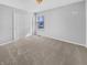 Bedroom with new carpet, a window with blinds and a closet with white doors at 1059 Sugar Maple Dr, Greenwood, IN 46143