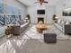 Bright and airy living room with fireplace, large windows, two sofas, and stylish decor at 1059 Sugar Maple Dr, Greenwood, IN 46143