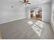 Bright living room with new carpet leading into an open kitchen area at 1059 Sugar Maple Dr, Greenwood, IN 46143