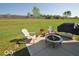 Outdoor patio with fire pit and backyard for entertaining guests at 11026 Cool Winds Way, Fishers, IN 46037