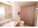 Functional bathroom with a neutral color scheme, a vanity with sink, and a shower with a curtain at 11026 Cool Winds Way, Fishers, IN 46037